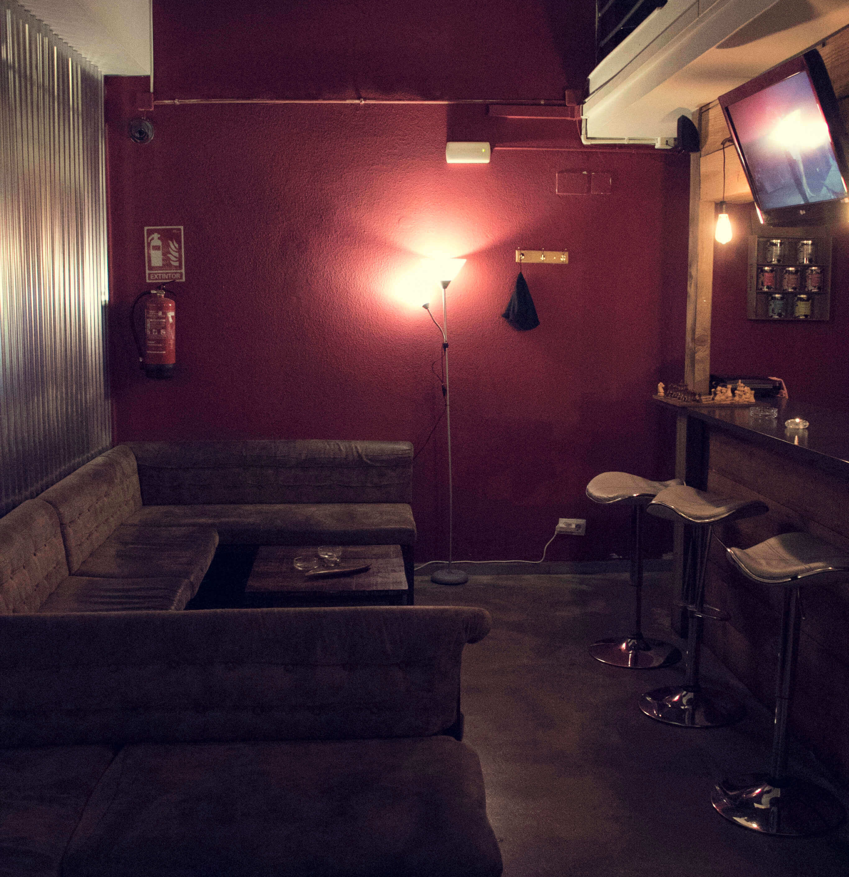 hash cannabis club sofas with table chilling area and bar